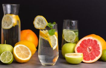 glasses of water with slices of fresh fruit